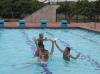 Playing at the school pool. / Jugar en la piscina del colegio.